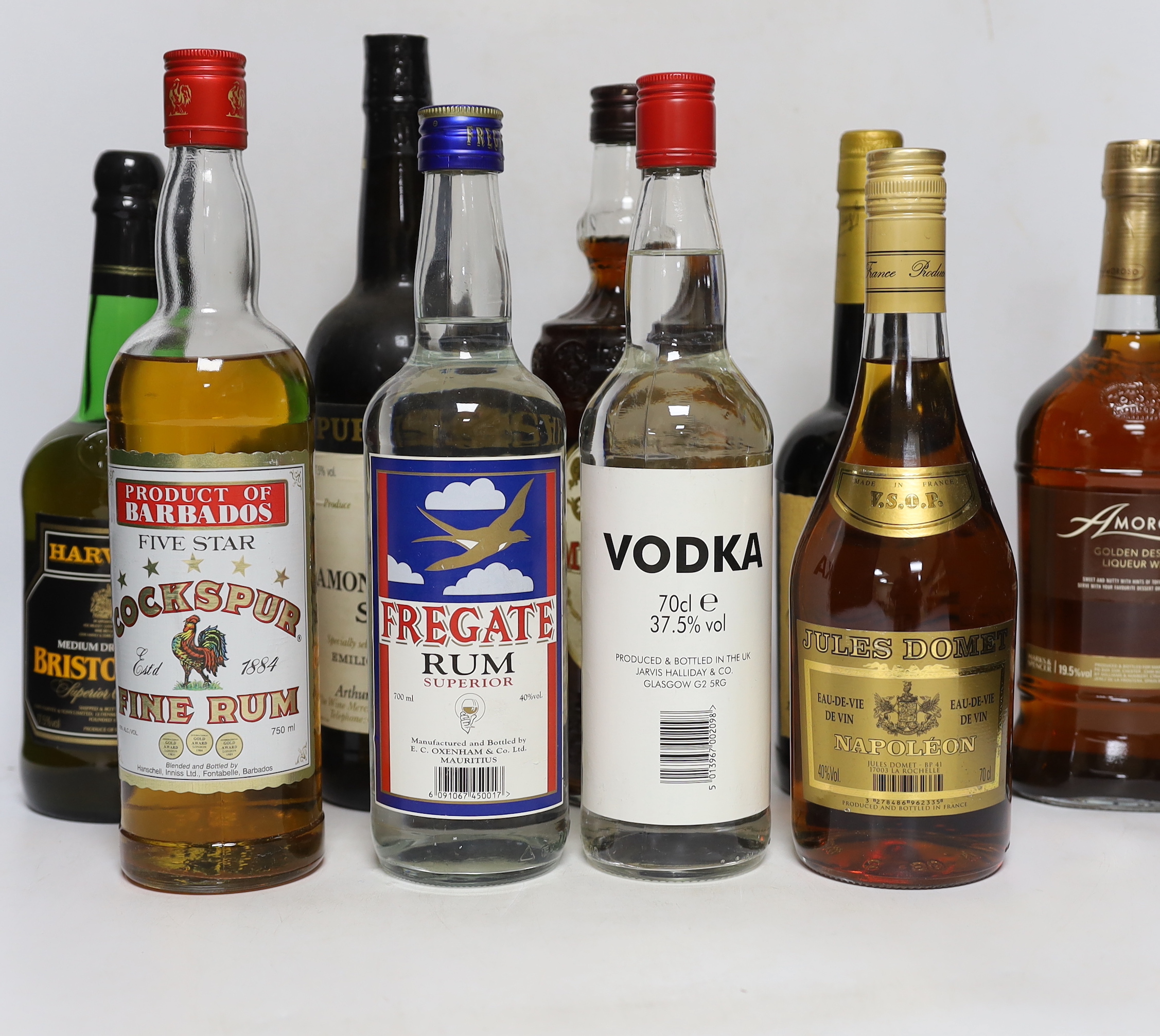 A selection of spirits, brandies and sherries to include Smirnoff, Jules Dumet, Cockspur etc